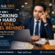 Syed Raheel Shahzad at a desk with laptop, bills and reminders asking why hard work still feels like falling behind